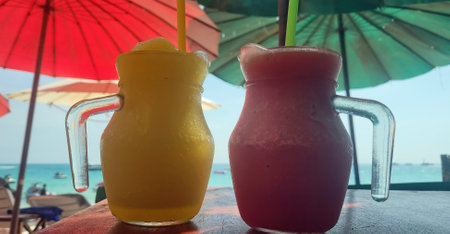 tasty mango and watermelon shake at a tropical beach in Thailandの写真素材