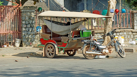 Kampot, Cambodia - circa February 2024: typical street transportationのeditorial素材