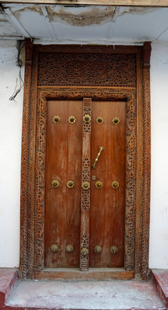 Traditional wooden door in Stonetown on Zanzibar Islandの写真素材