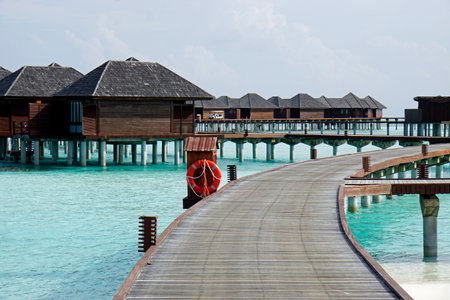 water villas on an island in the maldivesの写真素材