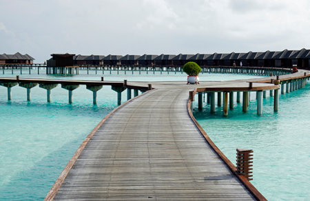 water villas on an island in the maldivesの写真素材