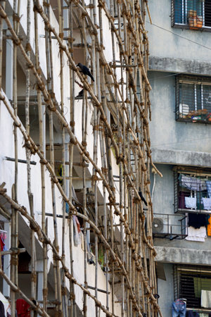 bamboo scaffolding on a building in mumbaiの写真素材