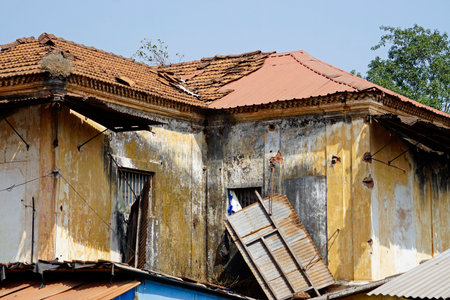 run down houses in goa in indiaの写真素材