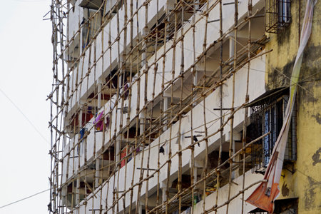 bamboo scaffolding on a building in mumbaiの写真素材
