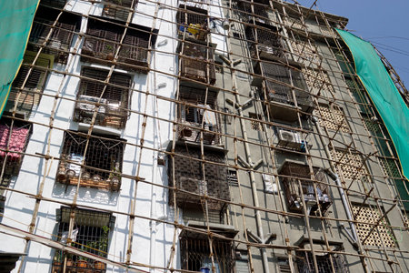 bamboo scaffolding on a building in mumbaiの写真素材