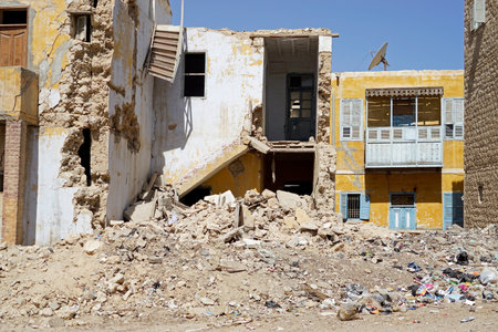 Ruined two-story building with hanging wooden staircase in el quseirの写真素材