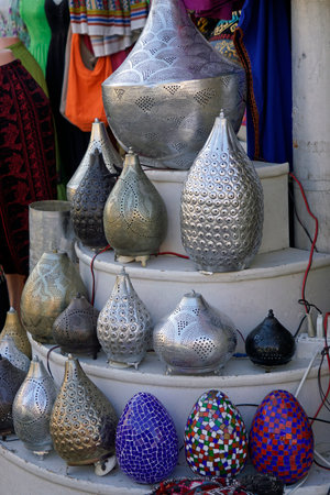 Rows of traditional metal lamps and mosaic eggs in Egypt