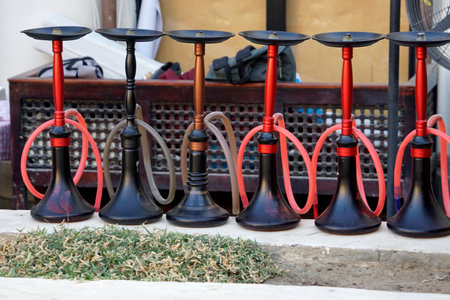 Rows of traditional ornate metal and glass shishas in Egyptの写真素材