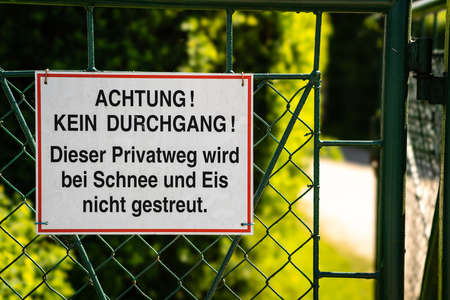 Attention - no entry allowed - no winter services - Achtung - kein Durchgang - Eis und Schneeの写真素材