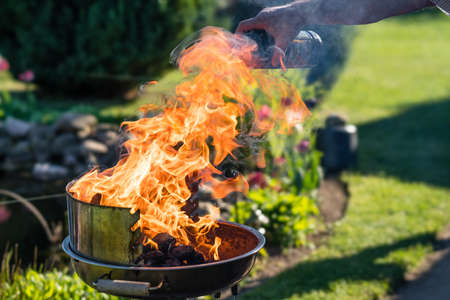 Liquid grill lighter on a charcoal grillの写真素材