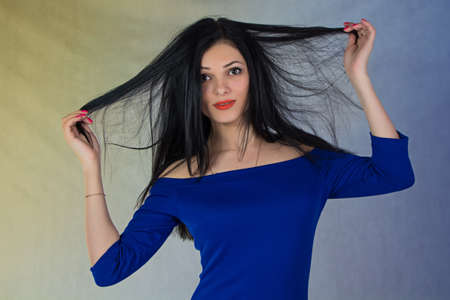 Smiling girl in blue dress - photo portraitの写真素材