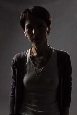 Woman in the shadow of light - photo portraitの写真素材