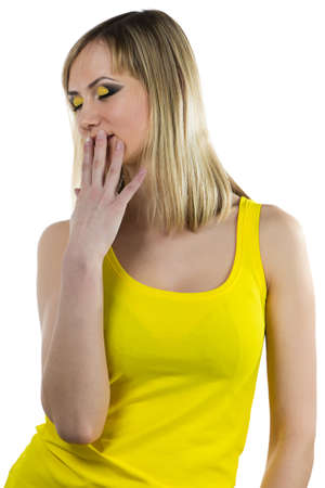 Young woman with yellow makeup - isolated photoの写真素材