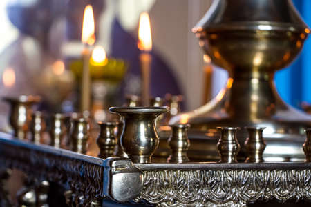Candlesticks in church - photo of candlesticks and candlesの写真素材
