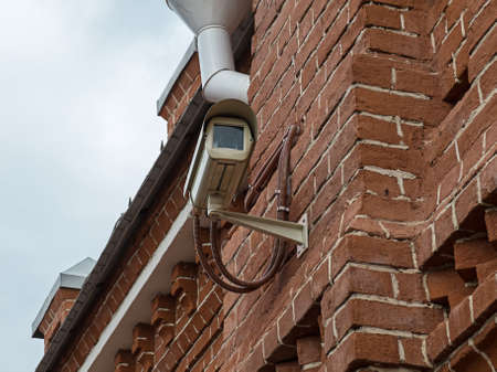 Image of security camera on the brick wall