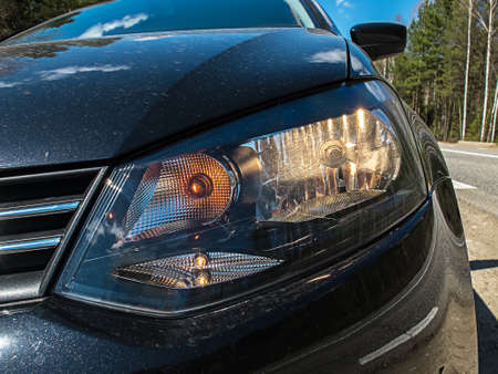 Image of headlight machine - black machine on the street