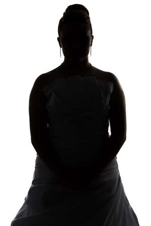 Silhouette of bride with arms crossed on white backgroundの写真素材