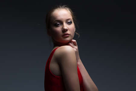 Photo of young girl on dark backgroundの写真素材