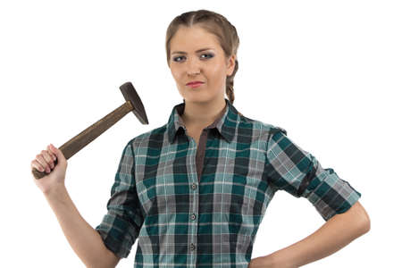 Photo of young woman with hammer on white backgroundの写真素材