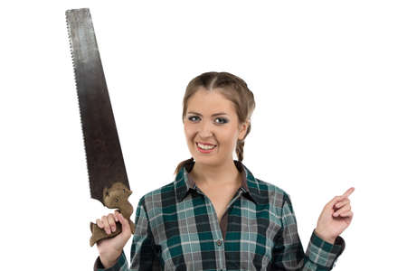 Photo of young woman with the hand saw on white backgroundの写真素材
