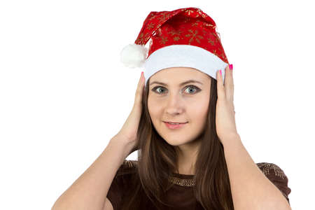 Photo of young woman correcting her hat on white backgroundの写真素材