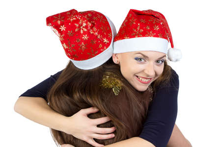 Portrait of two hugging young women on white backgroundの写真素材