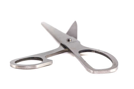 Photo of the opened vintage steel scissors on white backgroundの写真素材