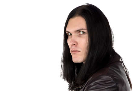 Image of man with stern look and long hair on white backgroundの写真素材