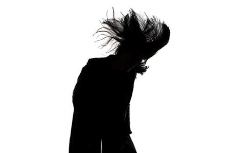 Image of mansilhouette with blowing hair on white の写真素材