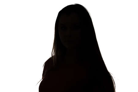 Photo of silhouette teenage girl on white background, half-turnedの写真素材