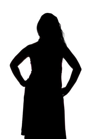 Silhouette of curvy woman with hands on hips on white backgroundの写真素材