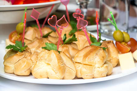 Photo of dish with profiteroles on white backgroundの写真素材