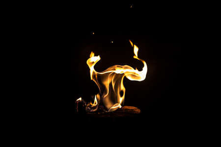 Image of dancing fire by night on black backgroundの写真素材