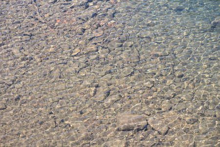 Image of the stones on the river bottom, on topの写真素材