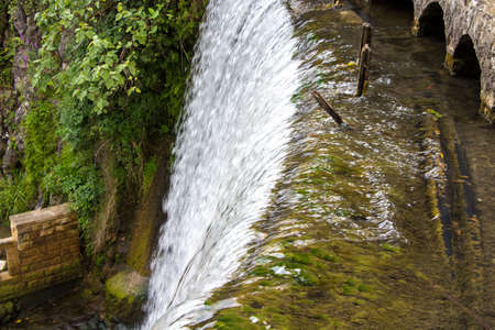 Photo of flowing down water among stones, summerの写真素材