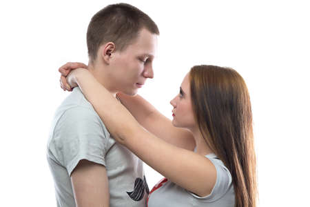 Photo of happy hugging teenagers on white background
