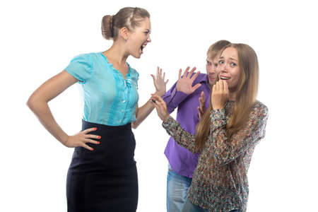 Photo of businesswoman screaming at frightened subordinates on white の写真素材