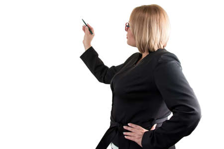 Business lady on white looking at something. Isolated photo with white background.の写真素材