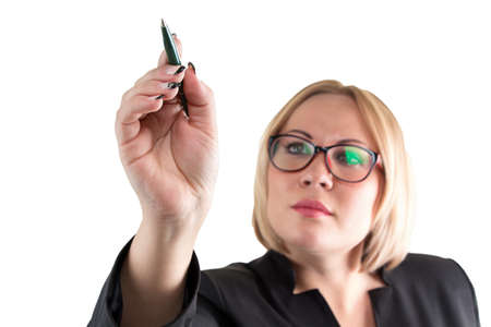 Business lady on white pointing at something. Isolated photo with white background.の写真素材