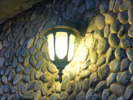 Street light and stone wall, in the summerの写真素材