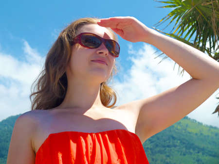 Happy young woman looking for, in the summer
