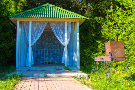 Small bower with curtains. Photo of summer hotel complex.の写真素材