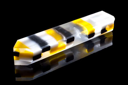 Pencil - glassy pendant with reflection on black background