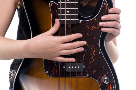 Hands on bass guitar on white background
