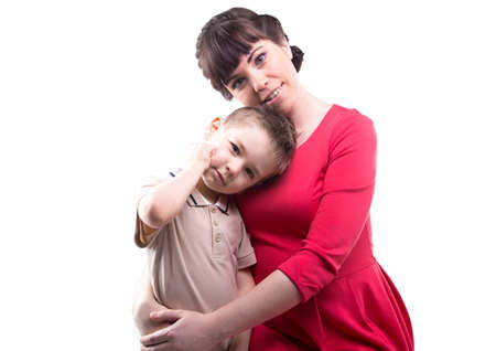 Hugging loving woman and her child on white backgroundの写真素材