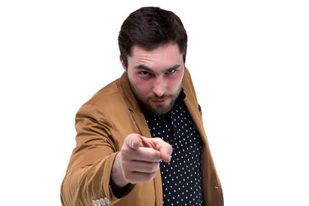 Bearded brunette man with forefinger on white backgroundの写真素材