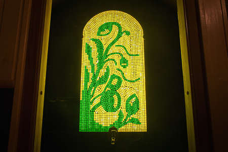Yellow stained glass in the interior, decoration of windowの写真素材