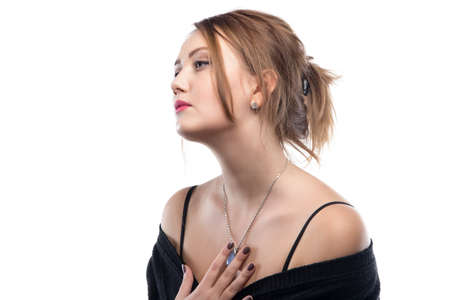 Portrait of blond woman with bare shoulders on white backgroundの写真素材