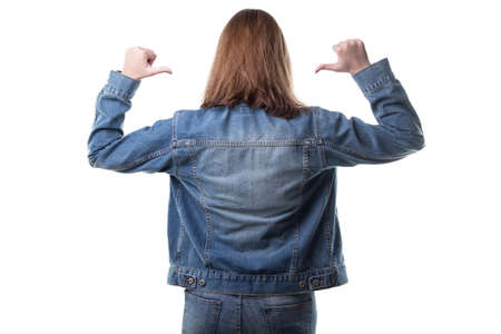 Woman wearing jeans jacket from back on white backgroundの写真素材