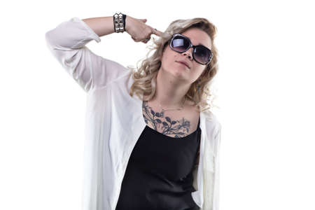 Blond woman with forefinger gun on white backgroundの写真素材